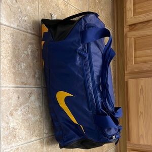 Nike Blue and Yellow Duffel Bag with Durable Design